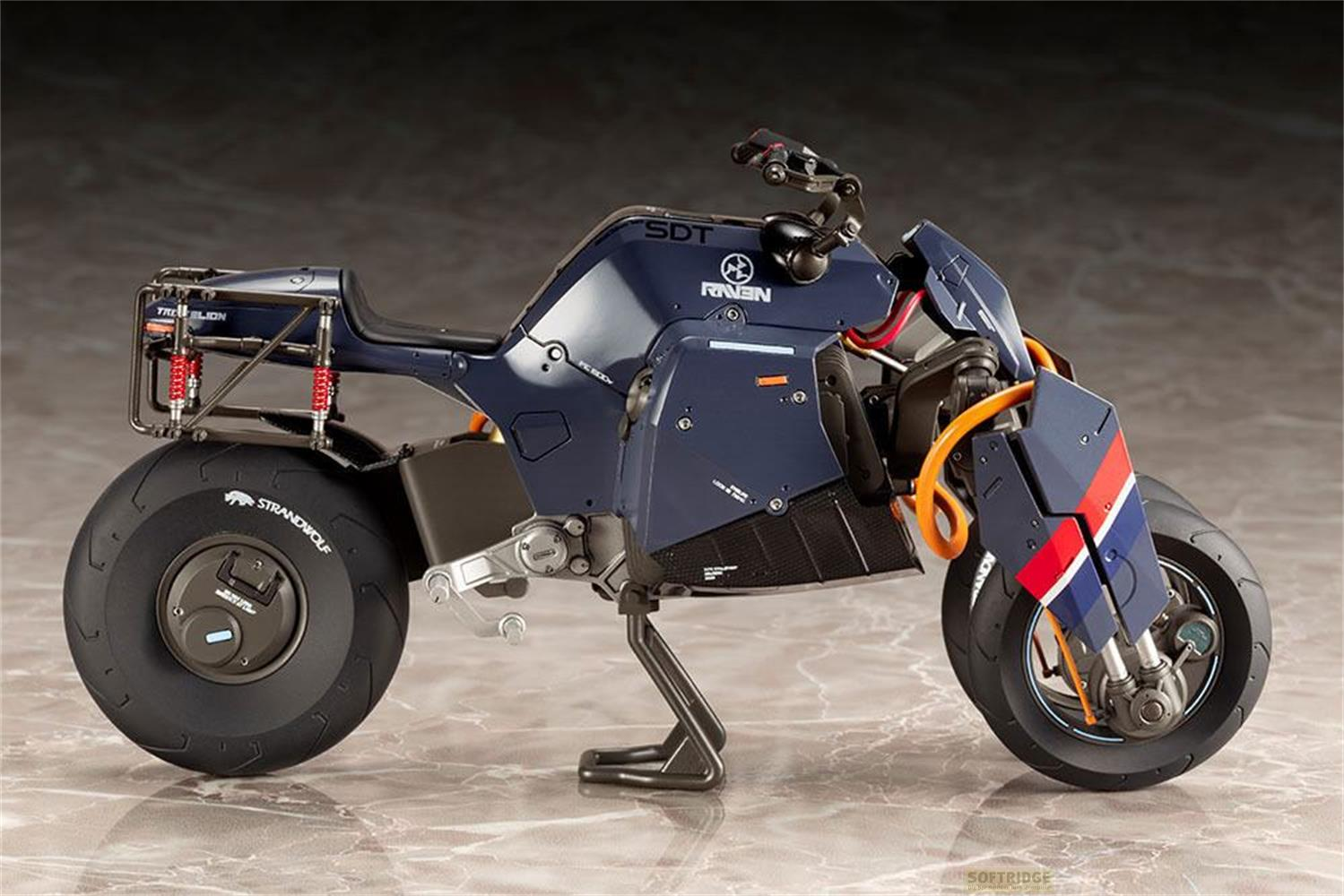 Moto bleu foncé avec accents orange et pneus larges.