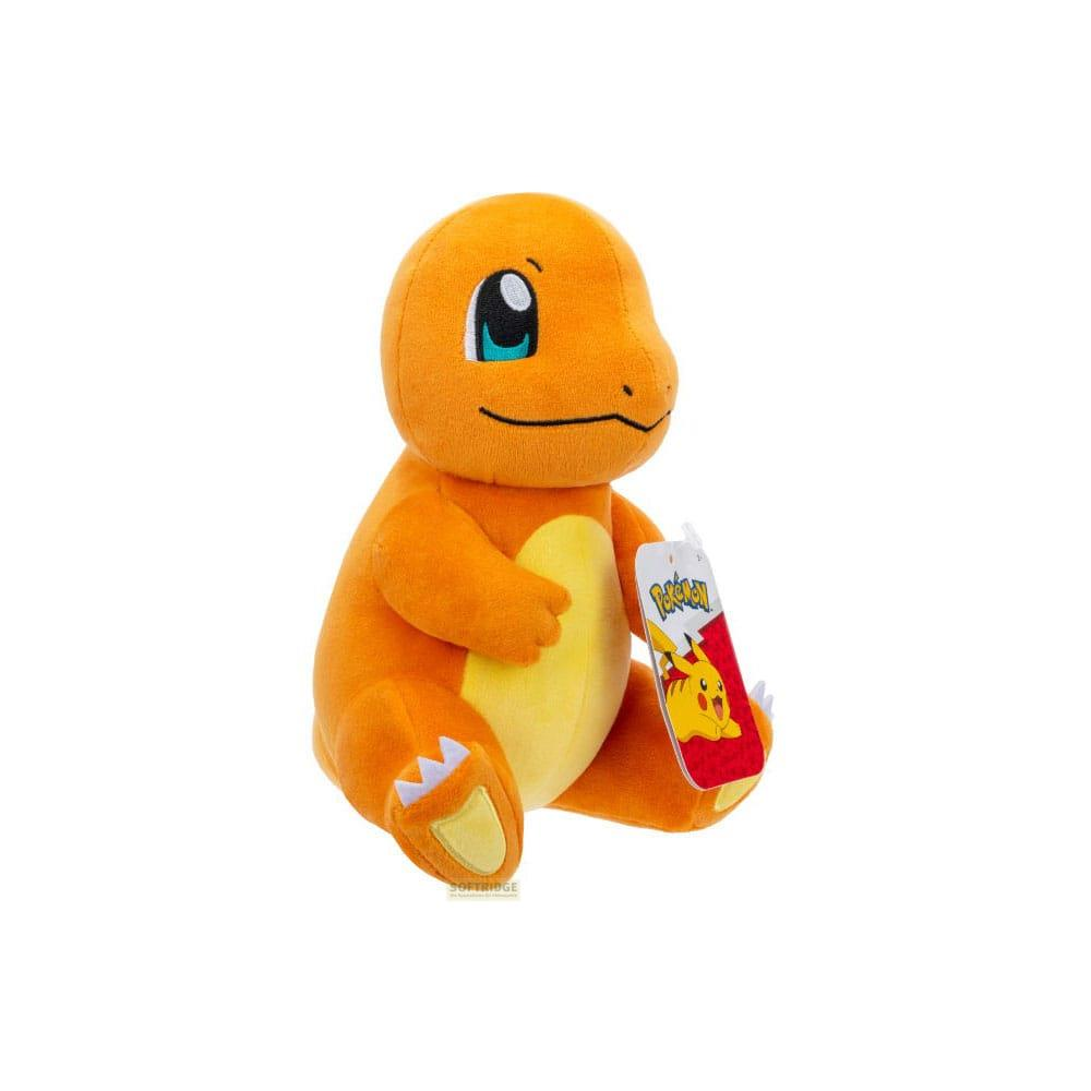 Peluche orange Charmander avec ventre et étiquette jaunes.