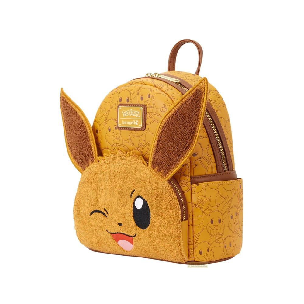Una mochila amarilla con la cara y orejas de Eevee, con estampado de Eevee.