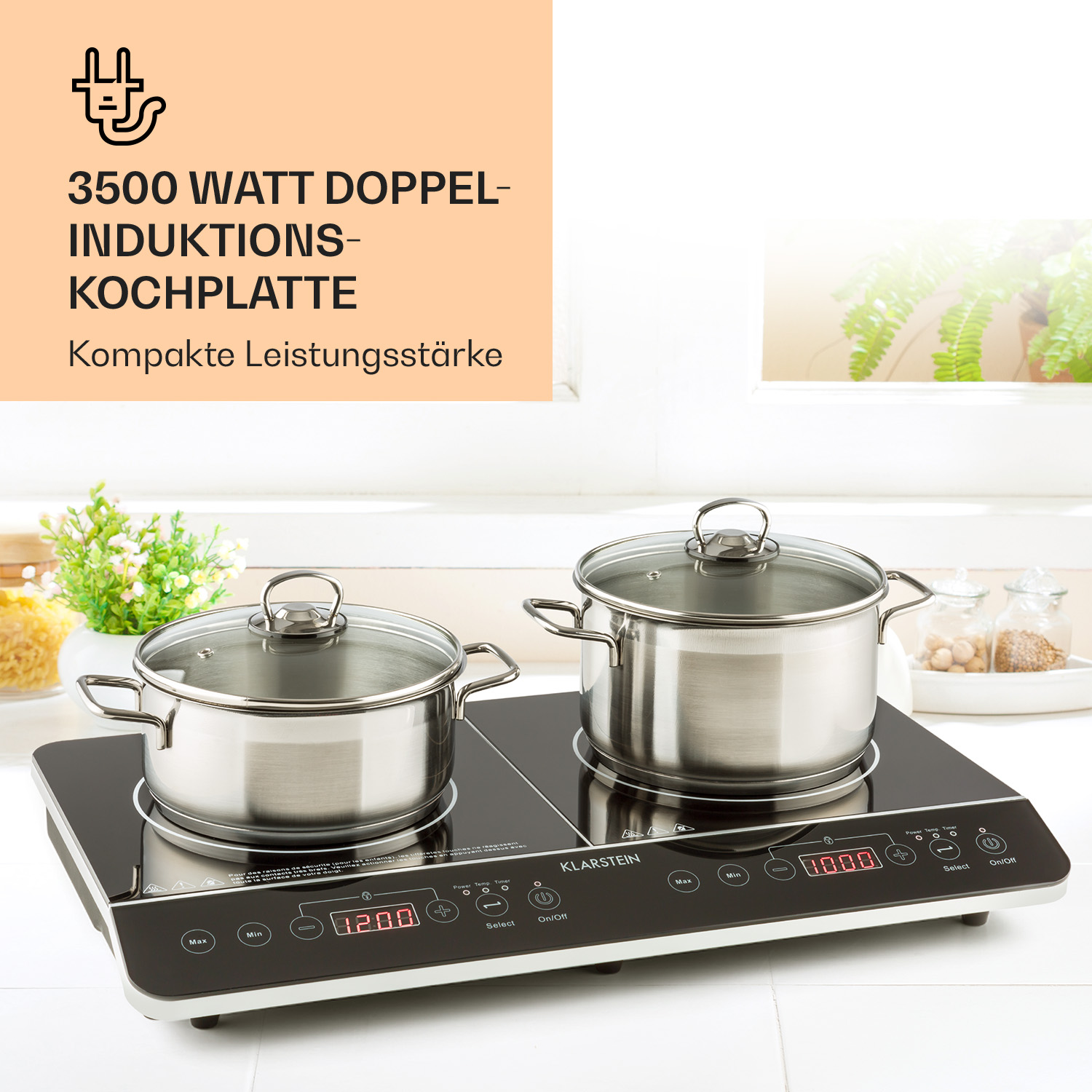 Doppel-Induktionskochplatte mit zwei Edelstahlkochtöpfen und Glasdeckeln.
