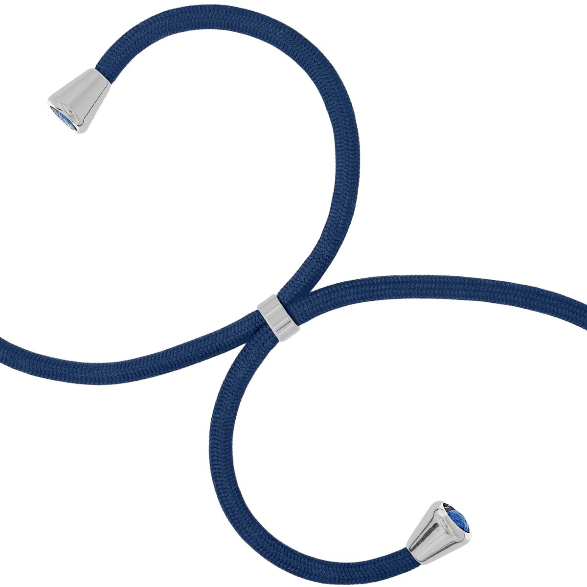 Ein dunkelblaues Kabel mit silbernen Kappen und blauen Edelsteinen.