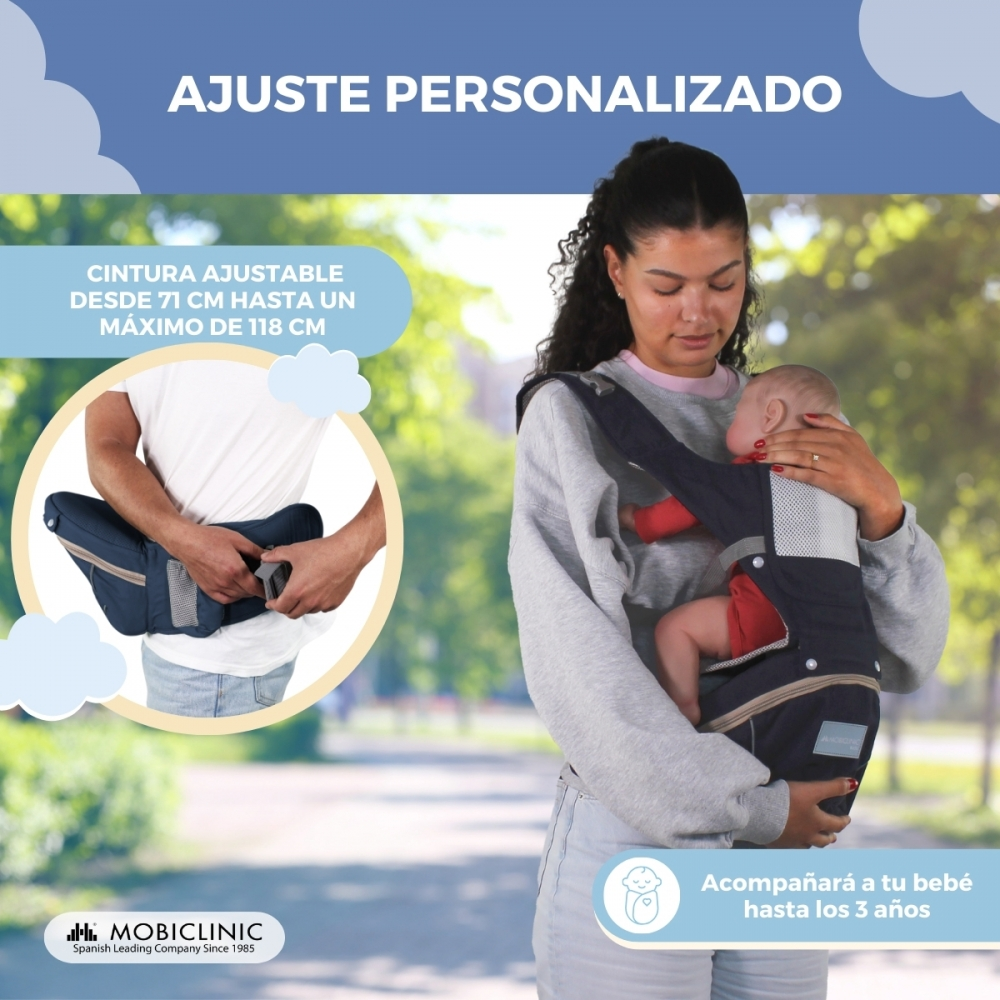 Una mujer lleva un bebé en un portabebés. Se muestra una cintura.