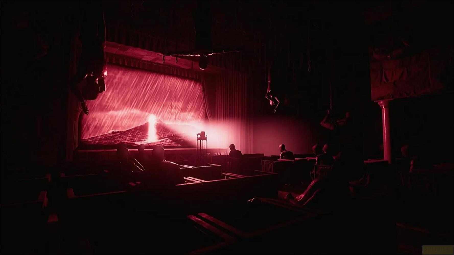 Ciemna scena z czerwonymi światłami, deszcz na ekranie, wiszący akrobaci.