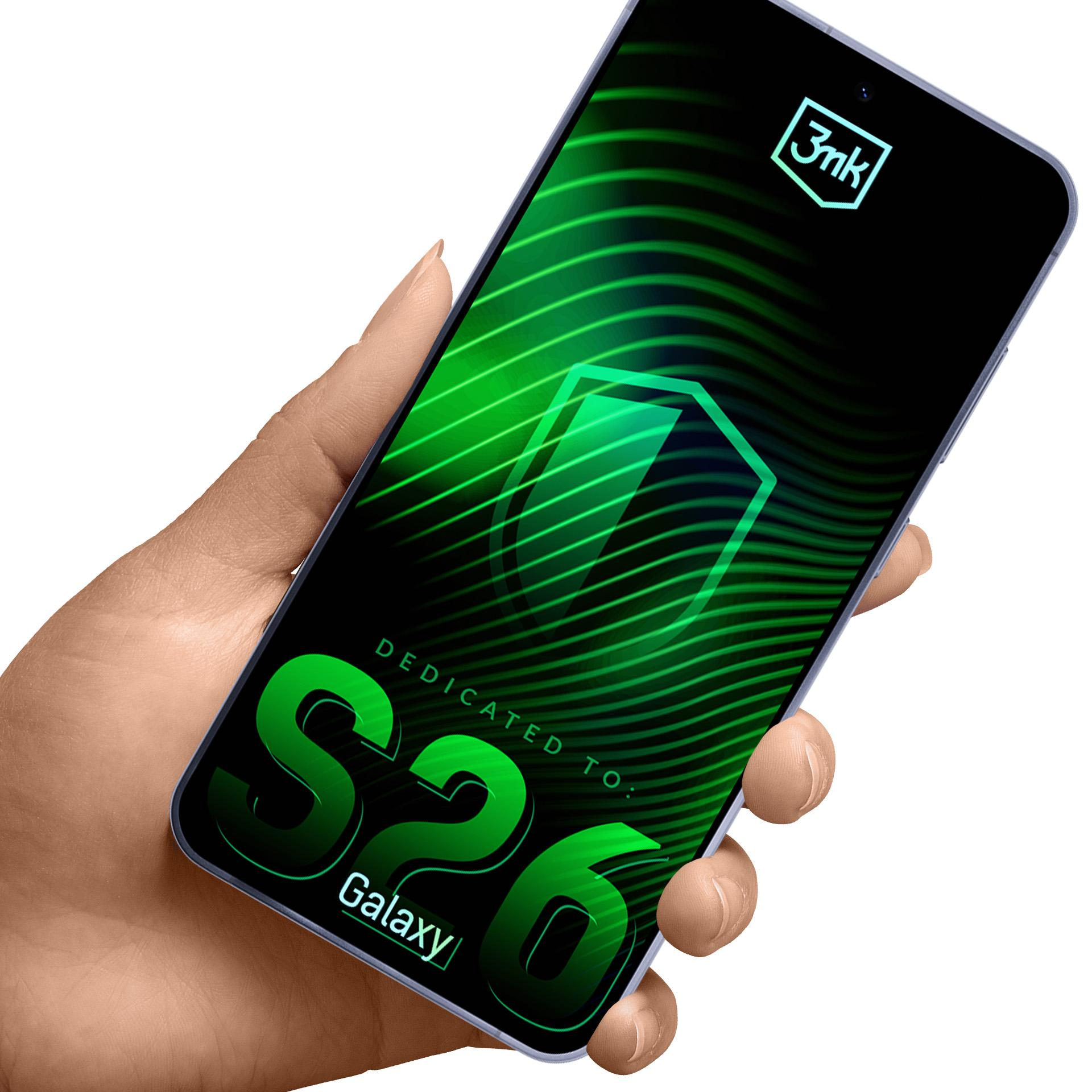 Dłoń trzyma smartfon z zielonymi falami i napisem "S26 Galaxy".