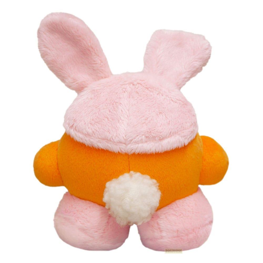 Un peluche de conejito naranja con orejas rosas y cola blanca.