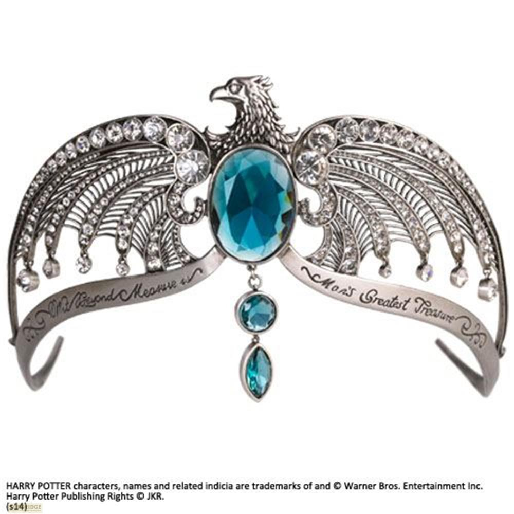 Una tiara plateada con cabeza de águila, gemas e inscripciones.
