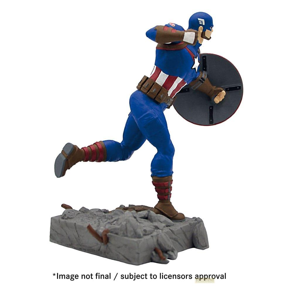 Figura de acción del Capitán América en traje azul, pecho rojo y blanco, sobre base de escombros.