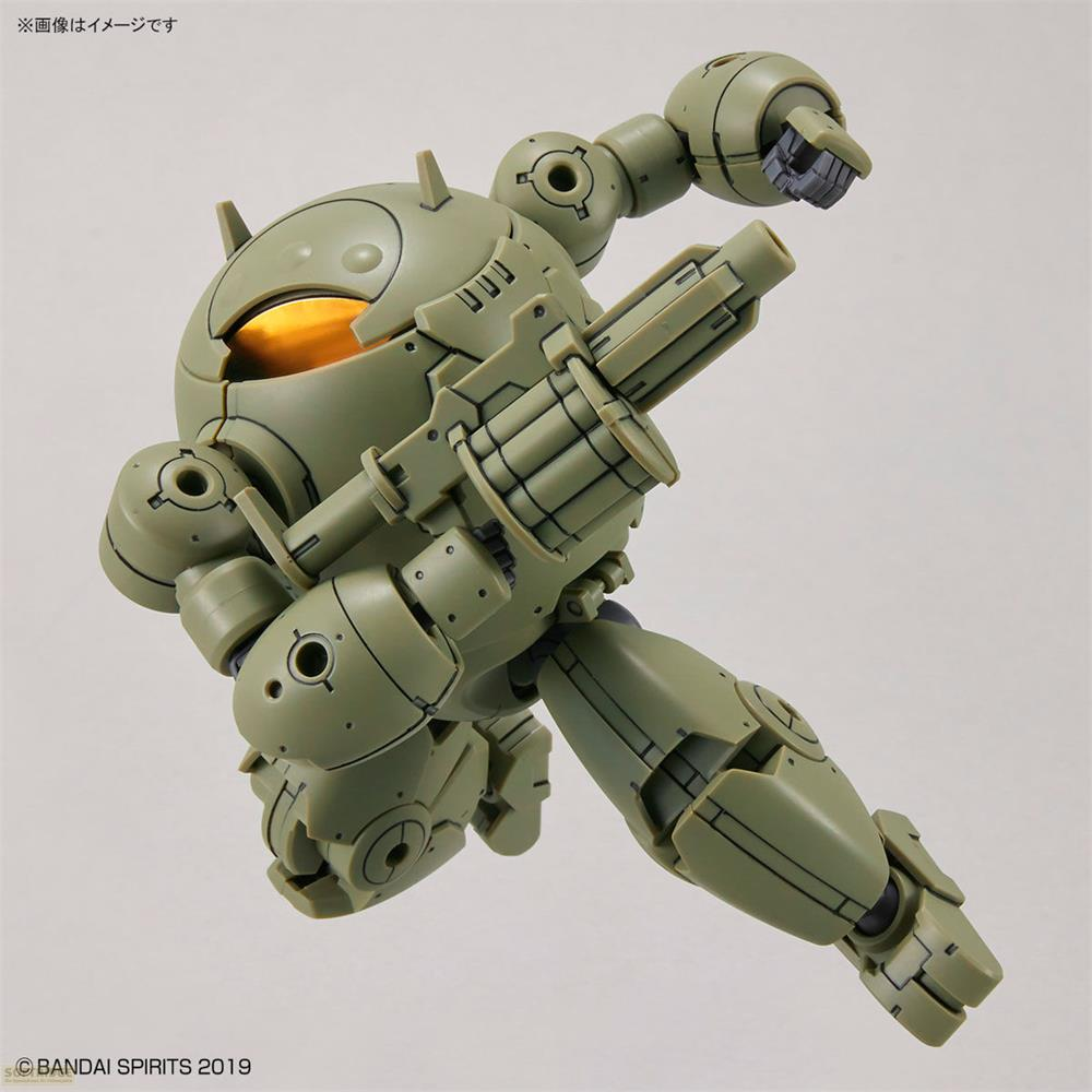 Ein grüner Roboter mit leuchtend gelben Augen hält eine Waffe.