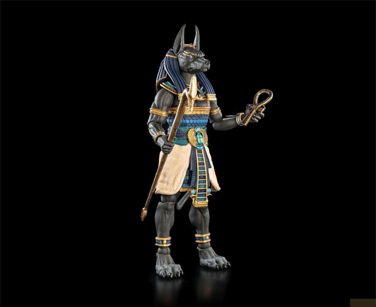 Figura di Anubi con testa di sciacallo che tiene un bastone e un simbolo ankh.