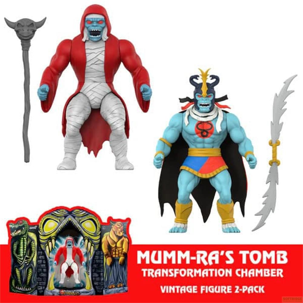 Due action figure, una rossa mummificata, una blu con mantello nero.