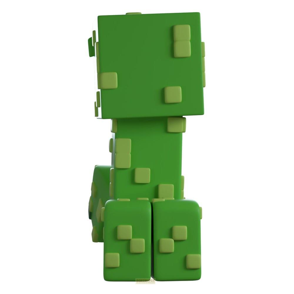 Figura verde de Creeper de Minecraft con cuadrados verde claro, vista de lado.