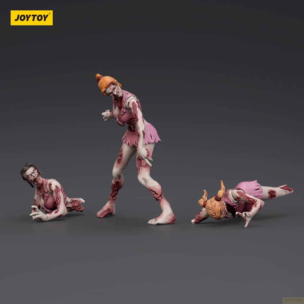 Tre zombie in vestiti rosa su sfondo grigio. Una in piedi, due strisciano.