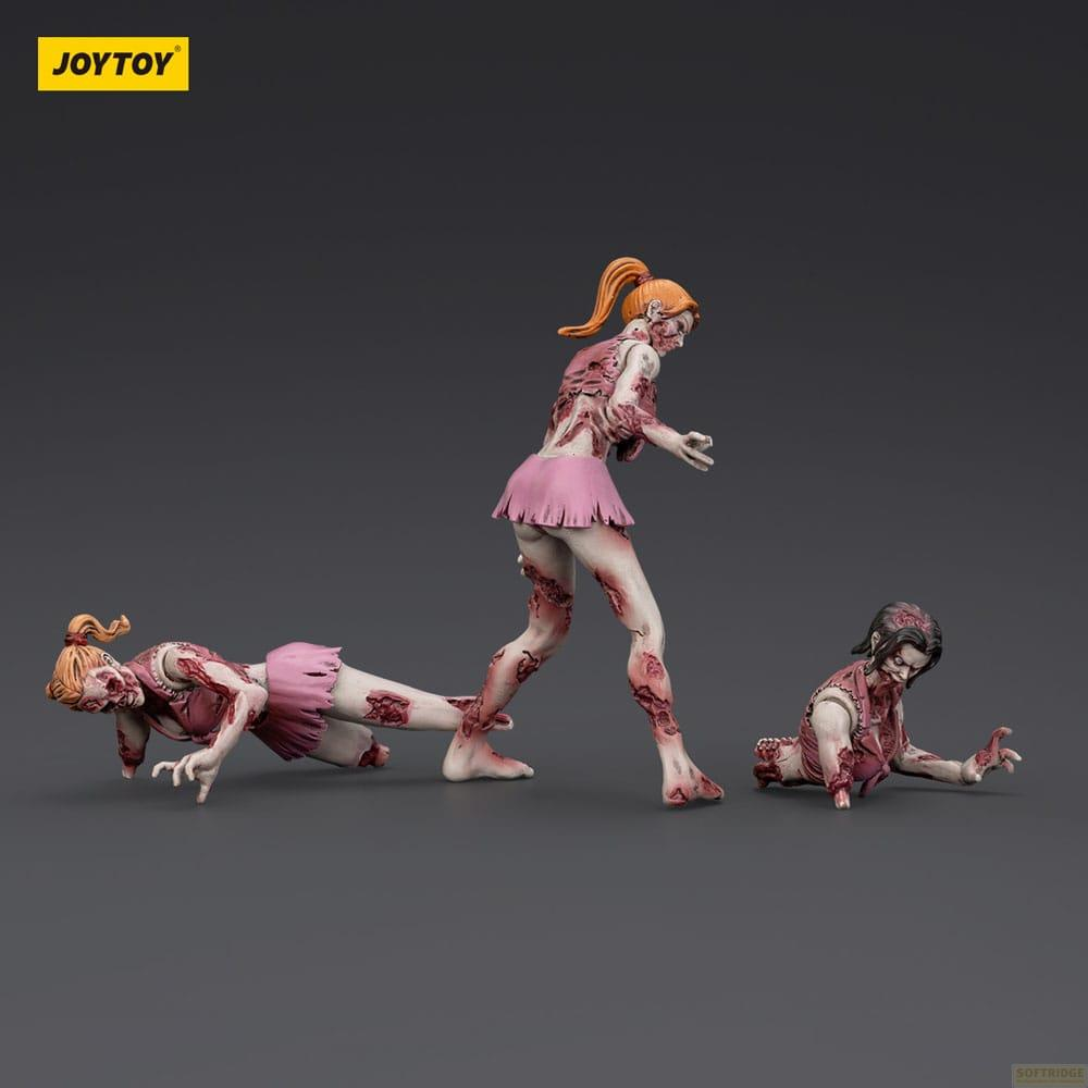 Tre figure zombie in gonne rosa su sfondo grigio.