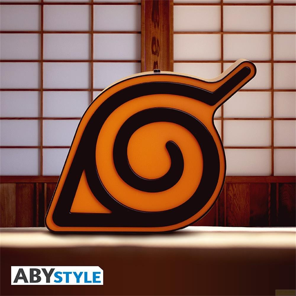 Símbolo de hoja naranja y negro con remolino frente a una pantalla japonesa.