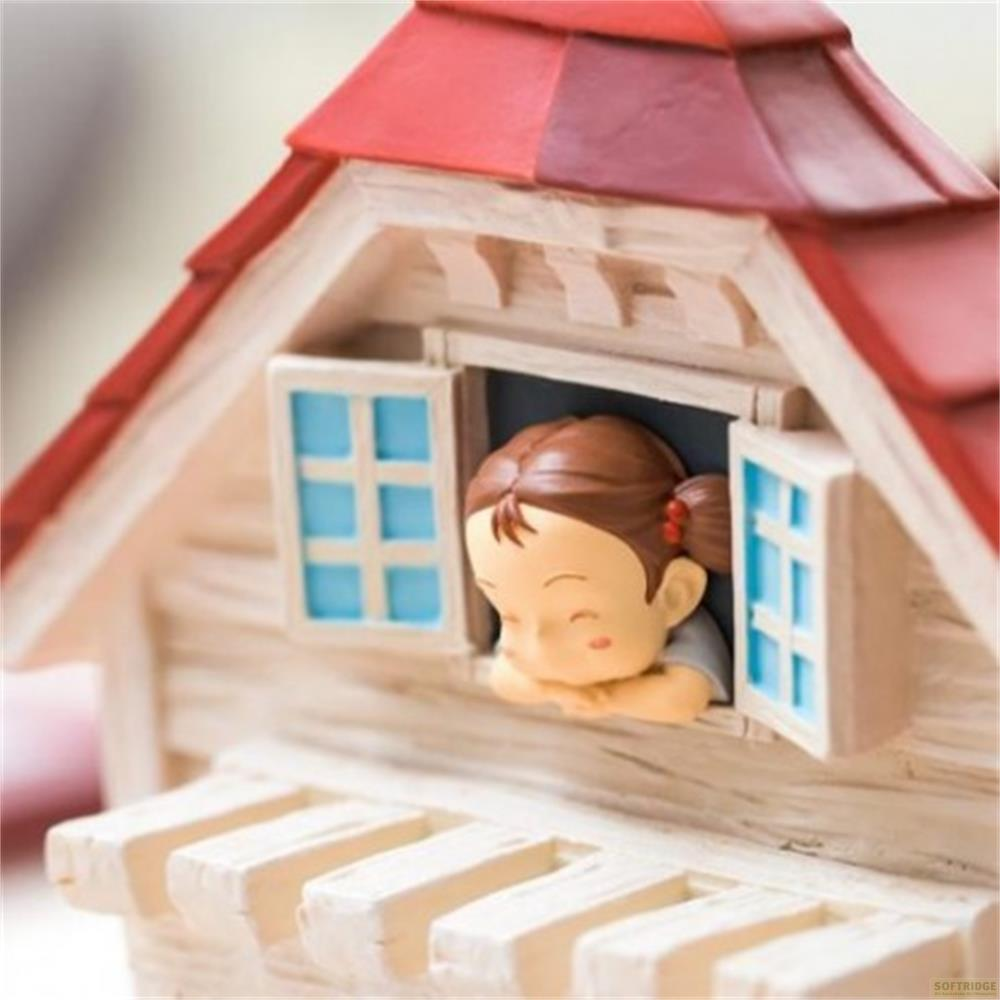 Une fille regarde par la fenêtre d'une petite maison.