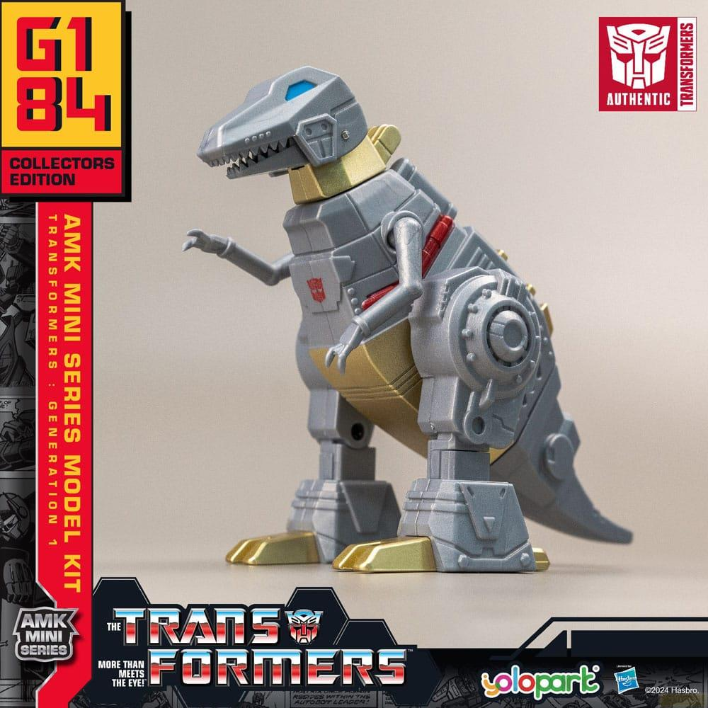 Grauer Dinosaurier-Roboter mit goldenen Akzenten, "Transformers"-Logo.