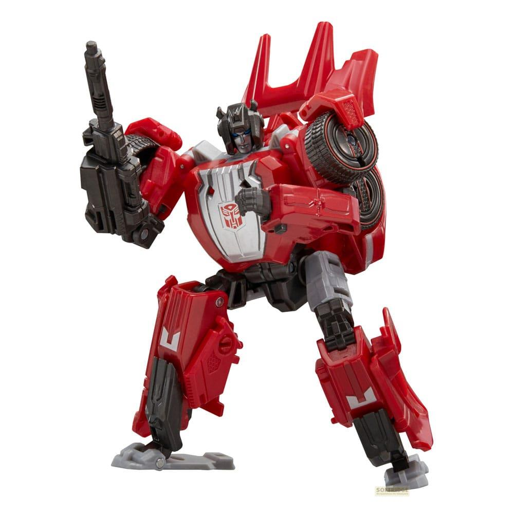 Robot rouge avec des accents gris tenant une arme.