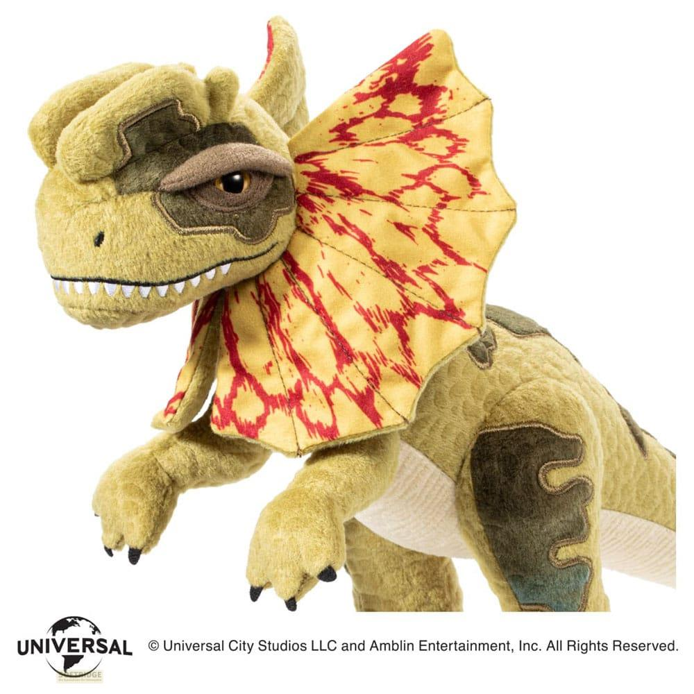 Un peluche de Dilophosaurus con un volante amarillo y con manchas rojas.