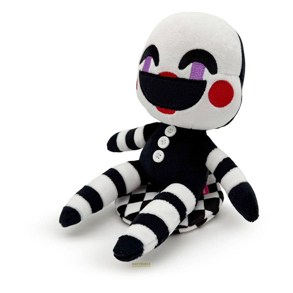 Une peluche marionnette noire et blanche avec bras et jambes rayés.