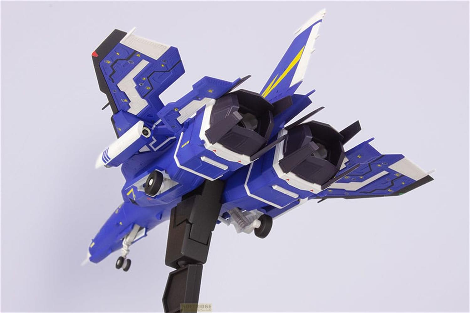 Ein blaues, futuristisches Flugzeugmodell mit gelben und weißen Akzenten.