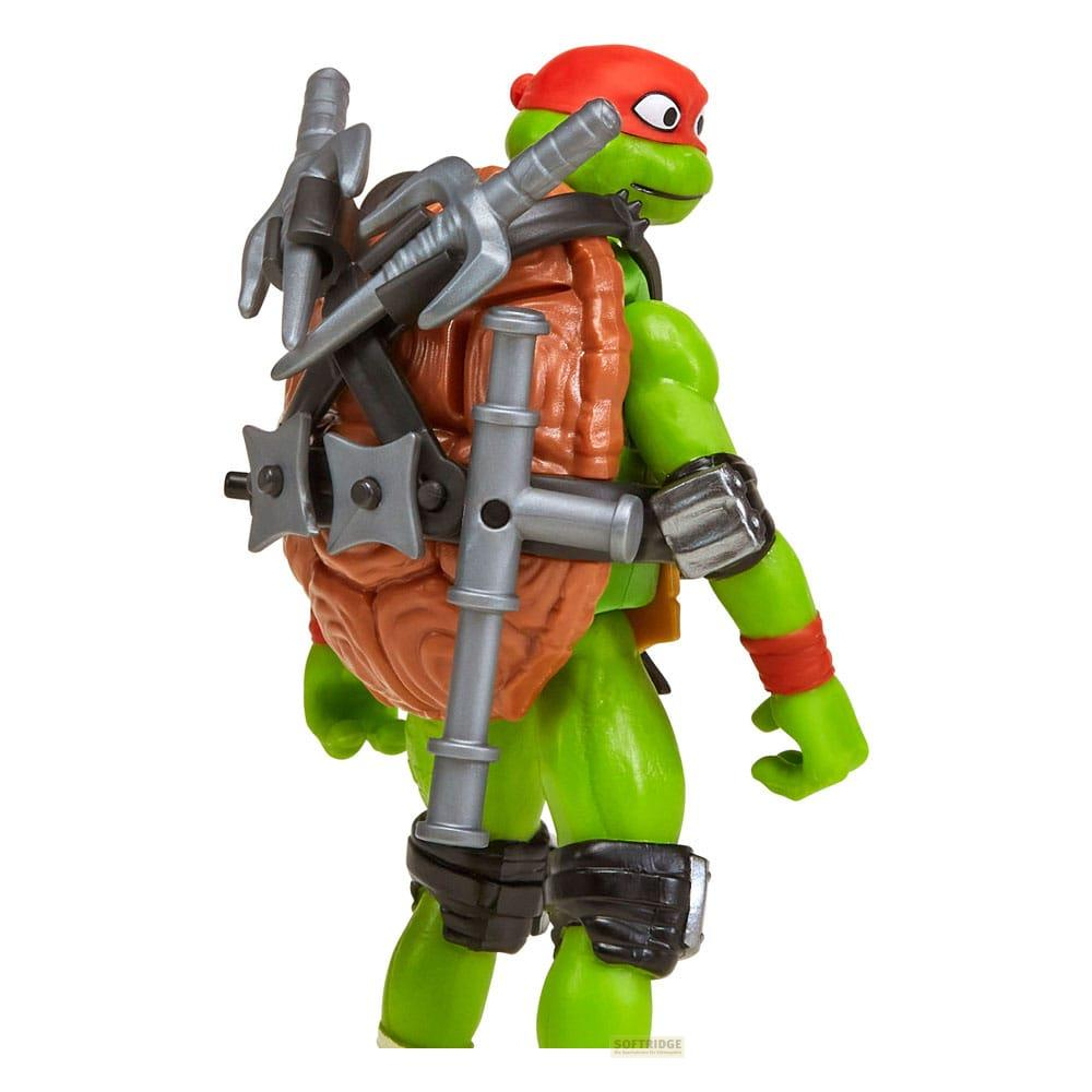 Una figura verde di Tartaruga Ninja Mutante Adolescente con bandana rossa e armi sulla schiena.