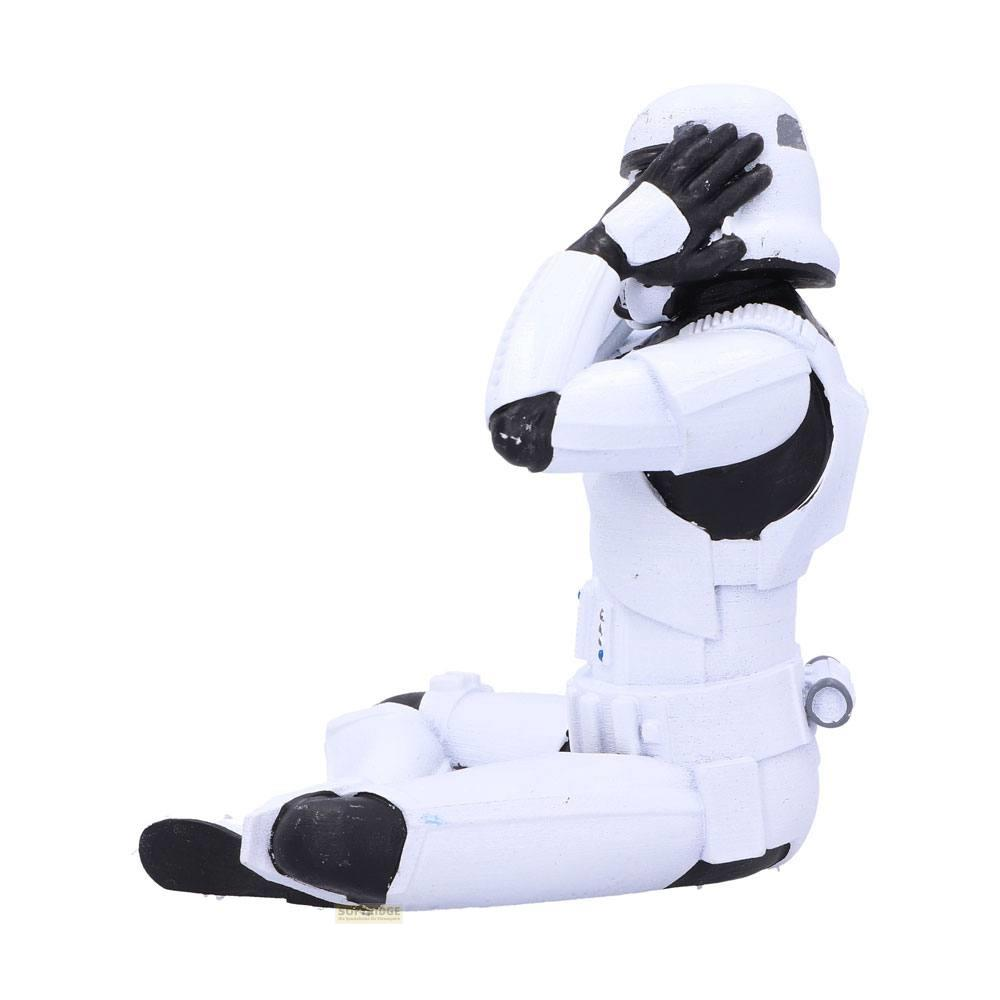Una figura de Stormtrooper se sienta cubriéndose los ojos con las manos.