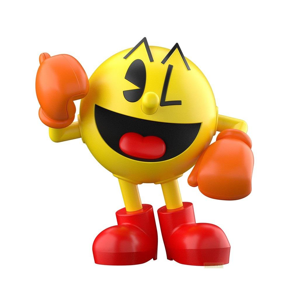 Pac-Man mit orangenen Handschuhen und roten Schuhen winkt.