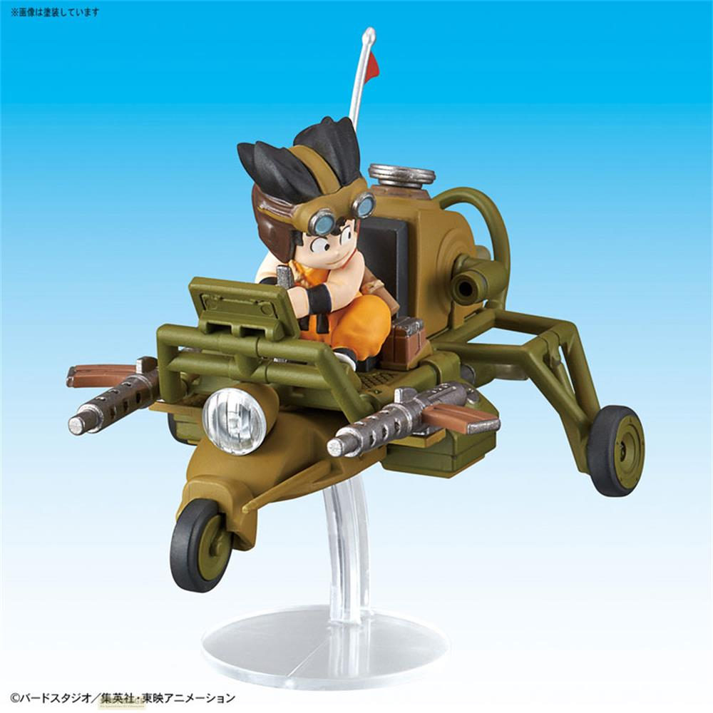 Une figurine aux cheveux bruns avec lunettes sur un véhicule vert avec armes.