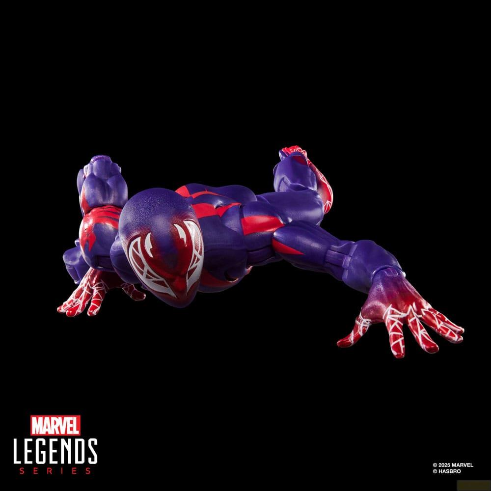 Figura de acción morada de Marvel Legends en pose de arrastre sobre fondo negro con patrón rojo y blanco.