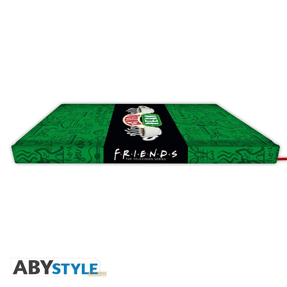 Livre vert avec logo Friends et motif tasses Central Perk.