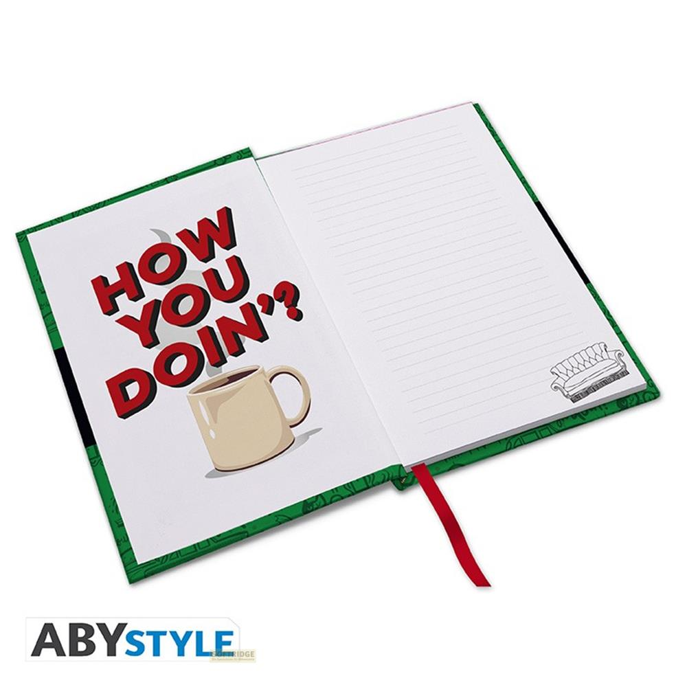 Un carnet ouvert sur "HOW YOU DOIN'?" et une tasse.