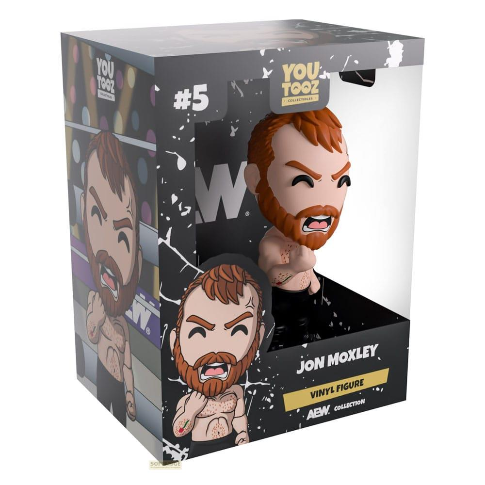 Jon Moxley Vinyl Figur in AEW-Sammlerbox, mit Comic-Illustration.