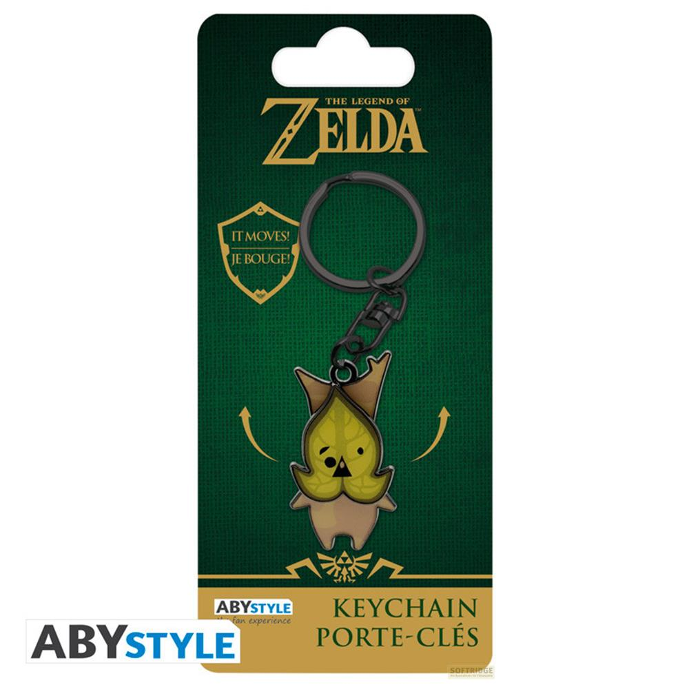 Porte-clés Korok Zelda sur fond vert avec texte et logos.