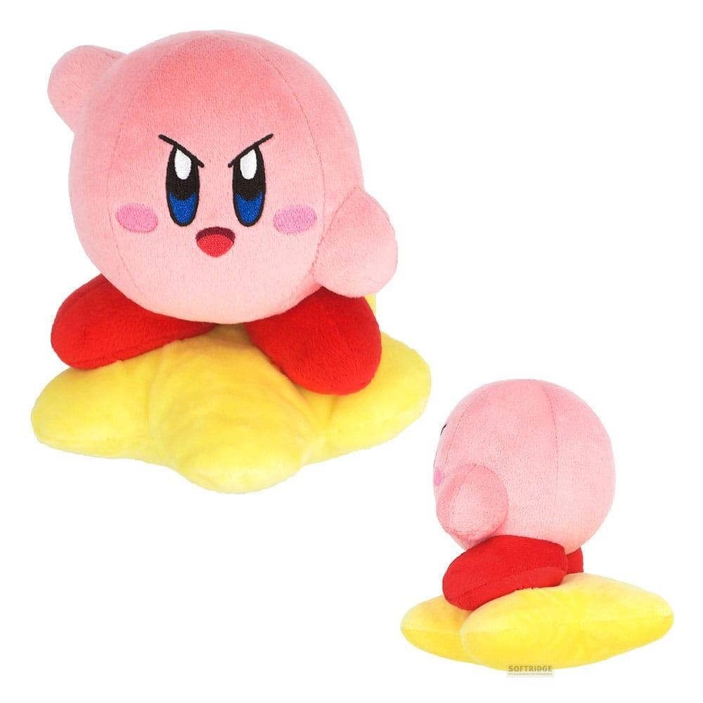 Une peluche rose Kirby est assise sur une étoile jaune. Une autre peluche est vue de profil.