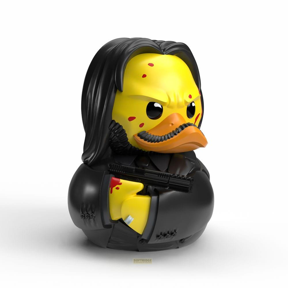 Un pato de goma amarillo con pelo negro, bigote y pistola.