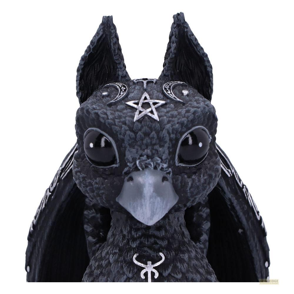 Una figura negra con estrella y lunas en la cabeza.