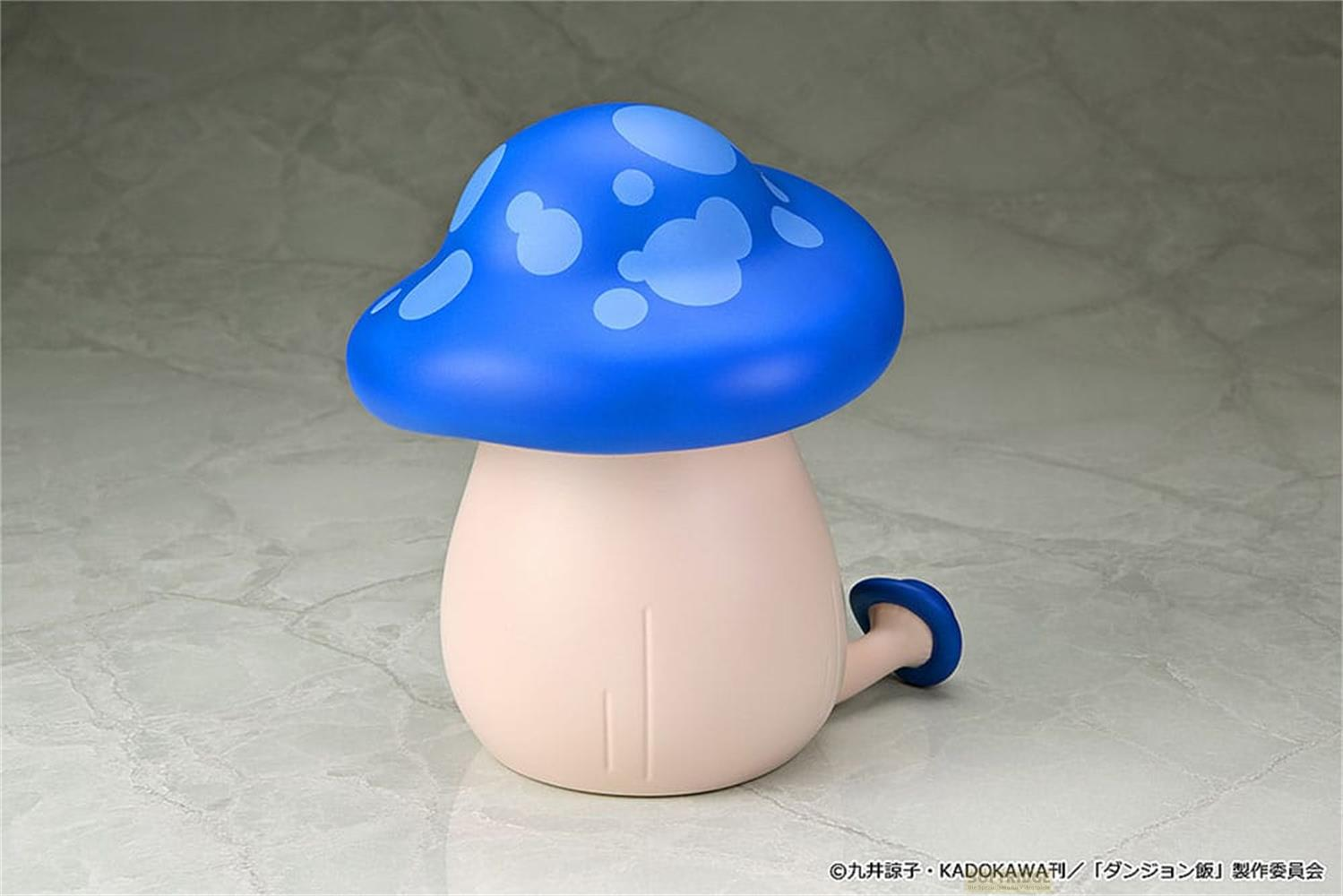 Una figura di fungo blu con macchie più chiare sul cappello e corpo beige pallido.