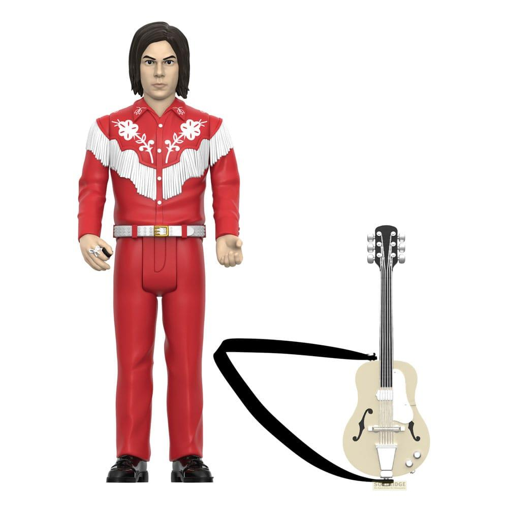 Una figura de acción con traje western rojo y flecos blancos, de pie junto a una guitarra crema.