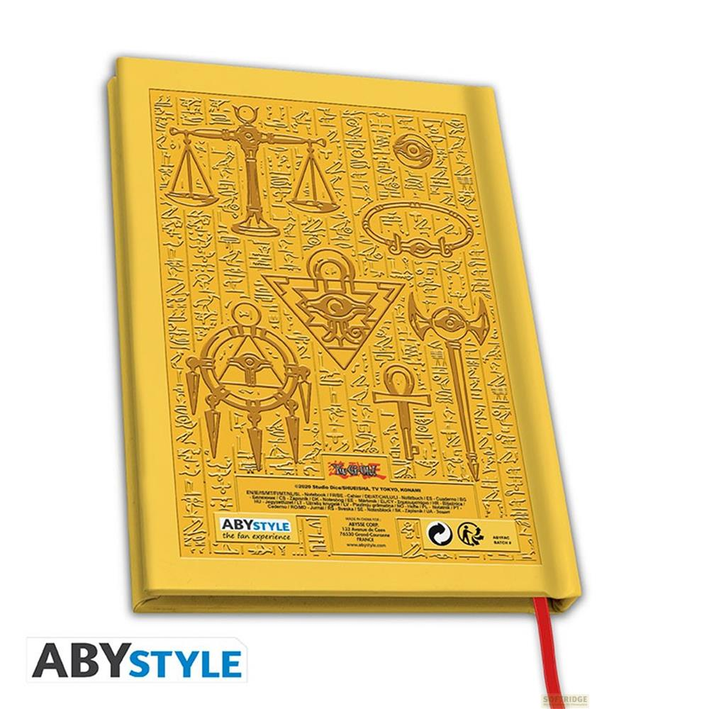 Un carnet doré gaufré de symboles et hiéroglyphes égyptiens.