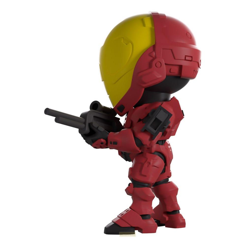 Ein rot-gelber Chibi-Charakter mit Waffe steht im Profil.