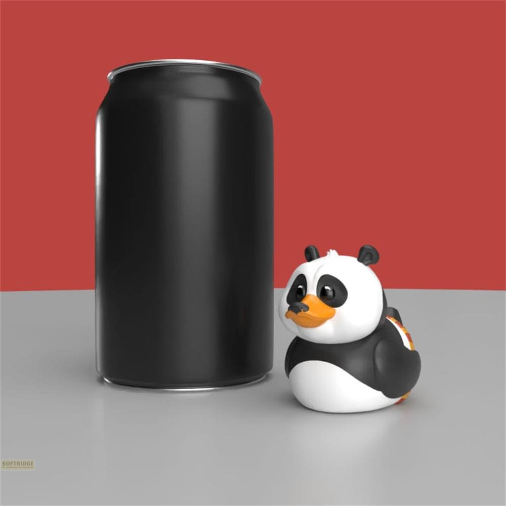 Schwarze Dose neben einer Panda-Gummi-Ente vor rotem Hintergrund.