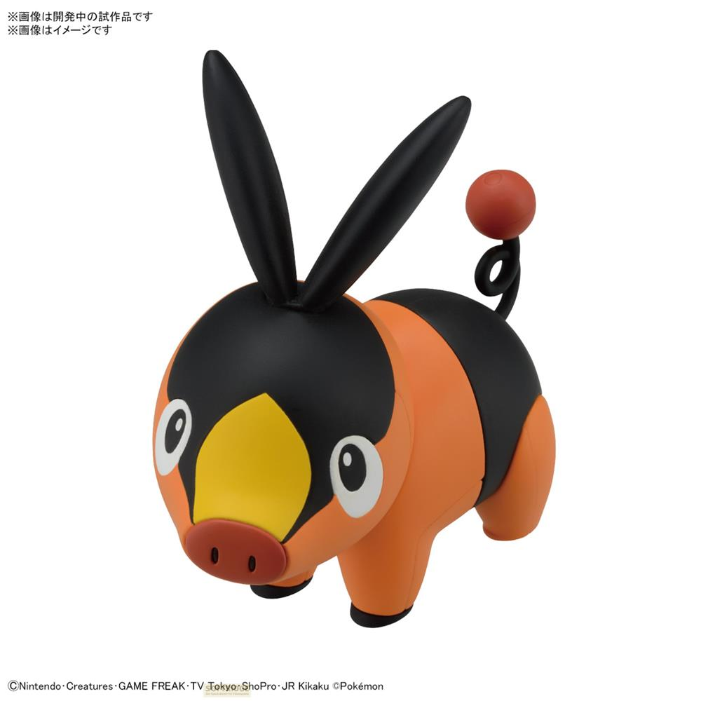 Un Pokémon orange et noir avec de longues oreilles et une queue ronde.