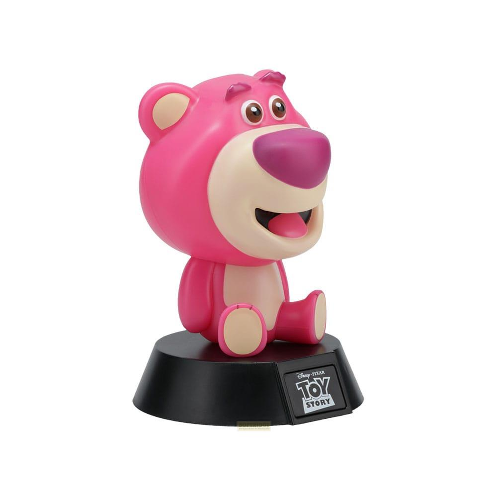 Różowy miś Lotso z Toy Story siedzi na czarnej podstawie.