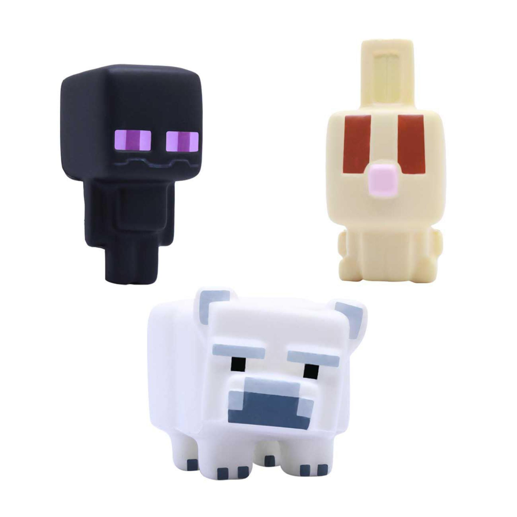 Drei Minecraft-Figuren: schwarz, gelb und weiß.