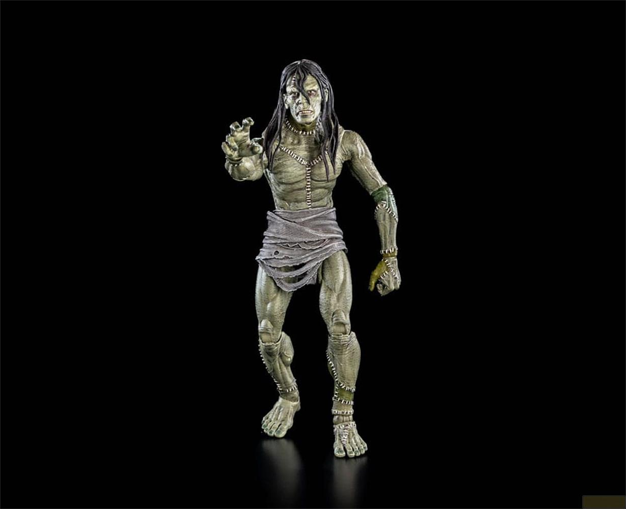 Eine grüne, genähte Monsterfigur mit dunklen Haaren und zerlumptem Stoff um die Taille.