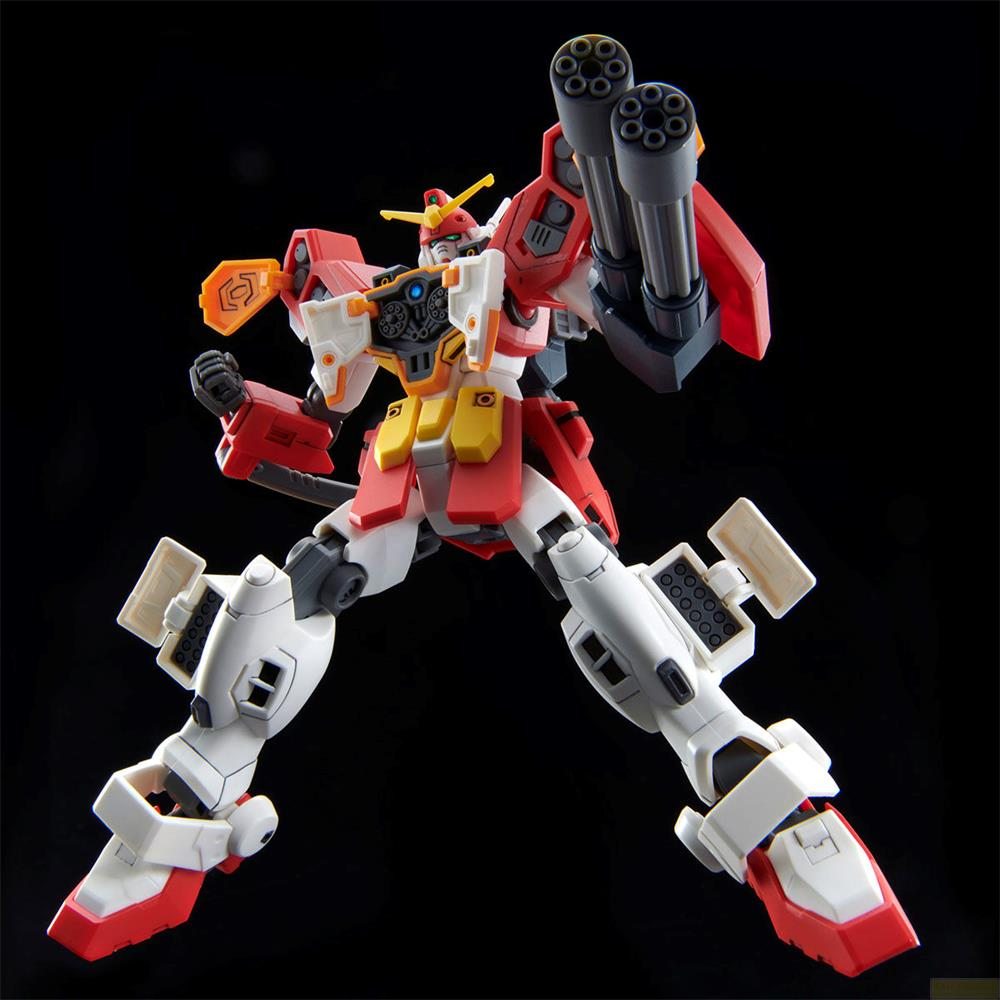 Un robot blanc et rouge avec deux gros canons, posant sur fond noir.
