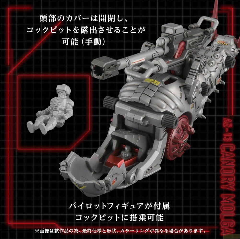 Modello di mech grigio con cabina aperta e figura di pilota accanto.