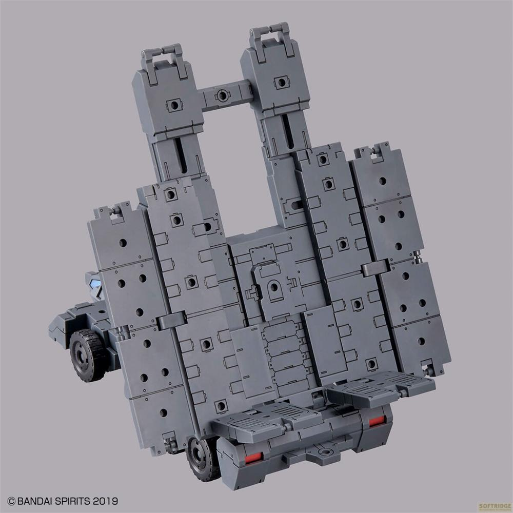 Composant mécanique gris avec roues et articulations, ressemblant à une remorque.