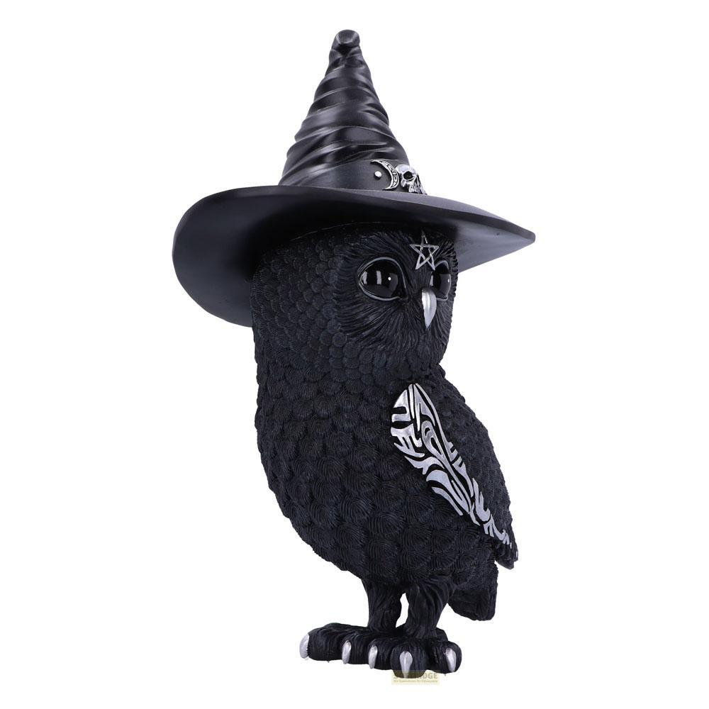 Figura de búho negro con sombrero de bruja y detalles plateados.