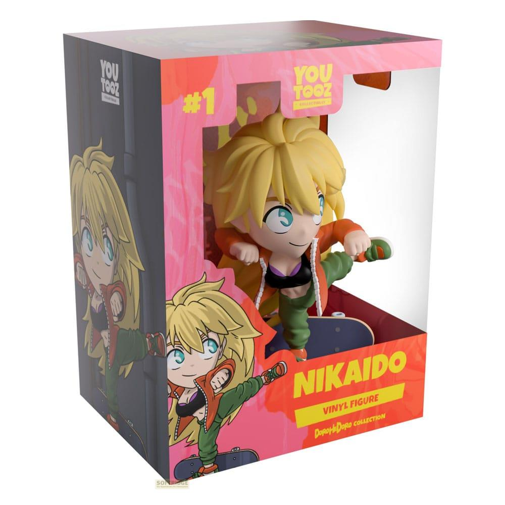 Nikaido Vinyl Figur in YOU TOOZ Verpackung, auf einem Skateboard stehend.